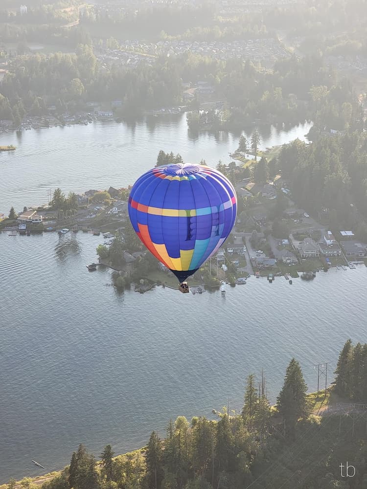 Hot air balloon flying to landing location