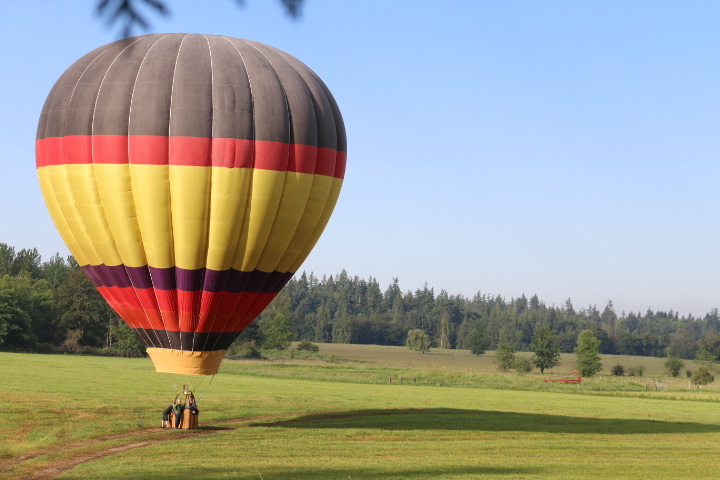 Hot Air Balloon Landing In A Pasture In Seattle Washington