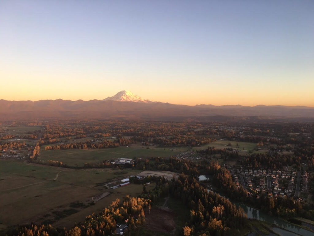 Hot air balloon flight by Mt. Rainier in Seattle at Sunset