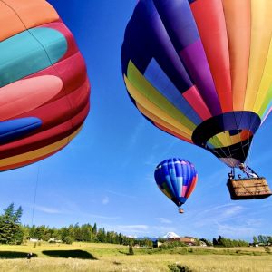 Three hot air balloons launching in washington state